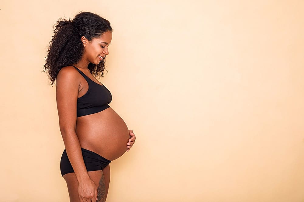 “Pregnant person reviewing ADHD medication plan with clinician—stimulants and bupropion safety during pregnancy.”